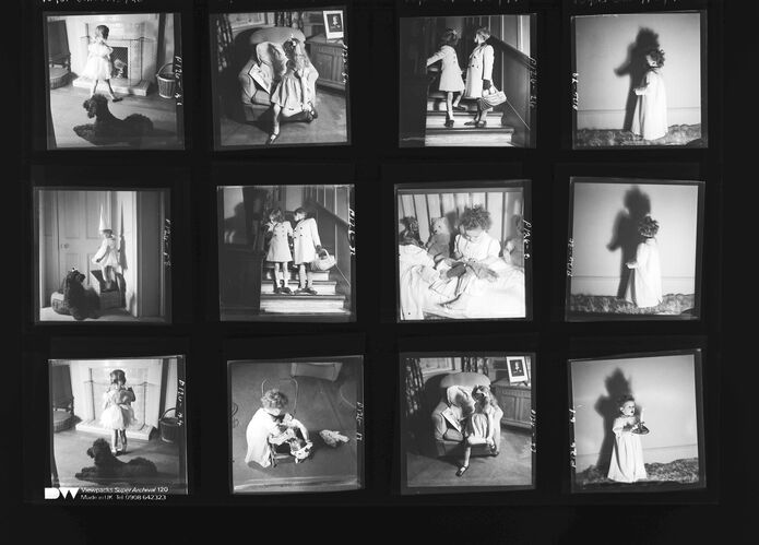 NP_NP05E1_1945_013: Girl with dunces hat and Dog