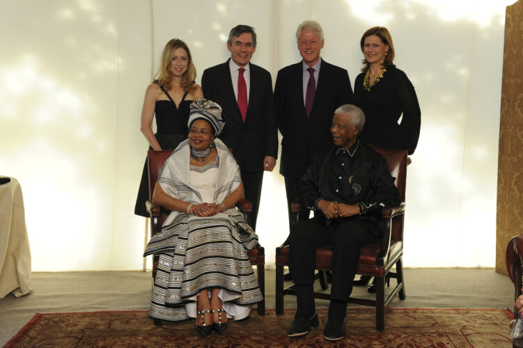 TON_NM007: Nelson Mandela with his wife Graça Machel and the Browns and Clintons